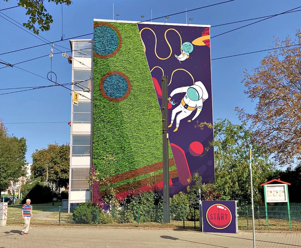 Die Stadtfelder Wohnungsgenossenschaft plant am Olvenstedter Platz ein Fassadenbegrünungsprojekt. Das Motiv mit Astronaut und Rakete symbolisiert den Start in eine grüne Zukunft. Die Rakete wird begrünt, der Astronaut vom Künstler bemalt.