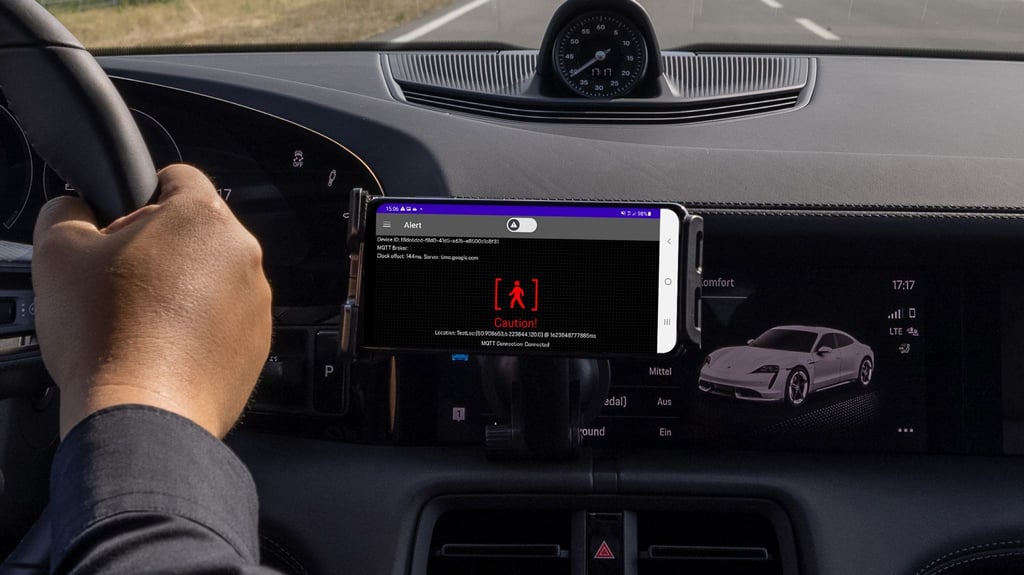 Eine Echtzeit-Warnung erscheint auf einem Mobiltelefon. Die alte Idee, dass Autos sich gegenseitig vor Gefahren warnen, wird in einer Machbarkeitsstudie mit Hilfe des schnellen 5G-Datenfunks neu umgesetzt.