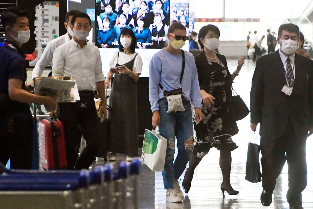 Sprinterin Kristina Timanowskaja auf dem internationalen Flughafen Narita.