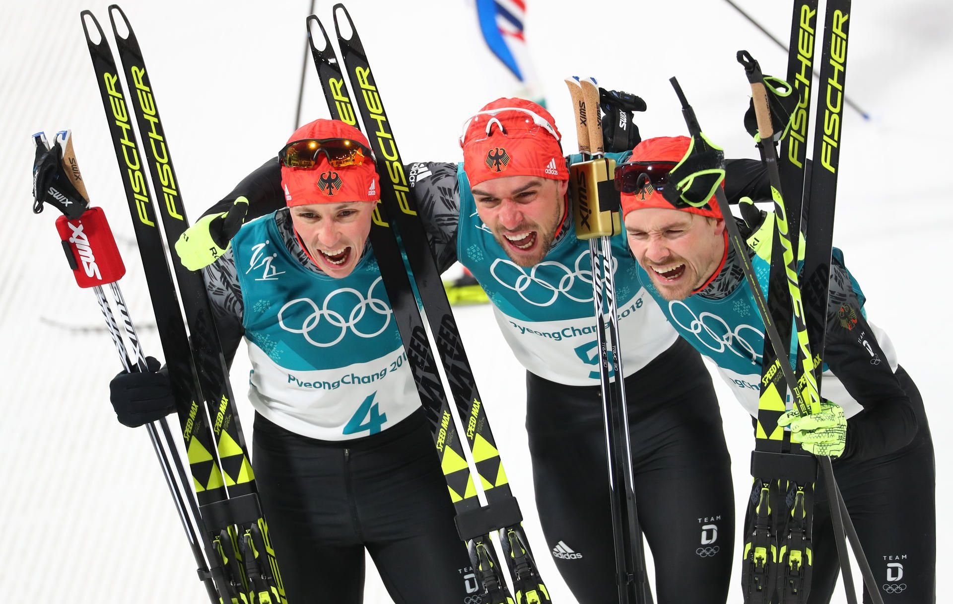 Die deutschen Podesteroberer von der Nordischen Kombination: Eric Frenzel (Bronze, v. links), Johannes Rydzek (Gold) und Fabian Riessle (Silber)