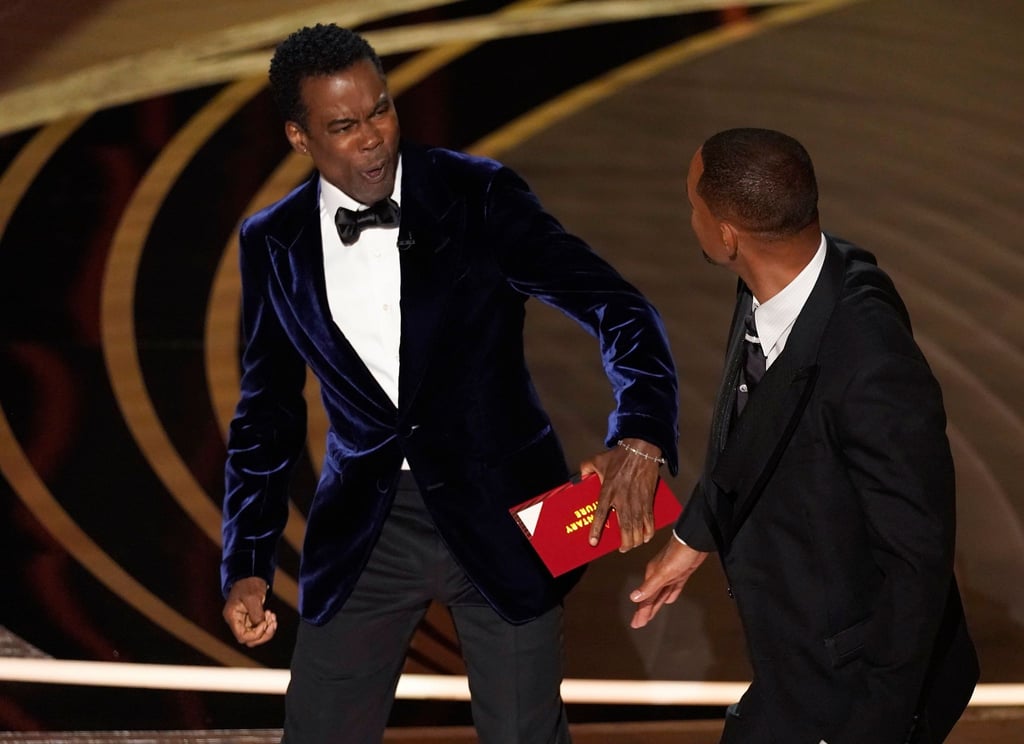 Chris Rock ist geschockt, nachdem er von Will Smith eine Ohrfeige bekommen hat.