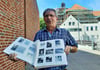 Dieter Müller (80) möchte die Lücke in der Geschichte der Hildebrandschule in Stendal schließen. Sein Fotoalbum spricht sprichwörtlich Bände. Im Hintergrund ist das Dach der Hildebrandschule zu sehen, das wegen Sanierungsarbeiten eingerüstet ist.