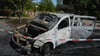 Der ausgebrannte Autowrack auf dem Mondsee-Parkplatz