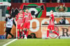 Torschütze Mergim Berisha (l-r), Dion Beljo und Jeffrey Gouweleeuw vom FC Augsburg jubeln über den Treffer zum 1:0 gegen Bayer Leverkusen.
