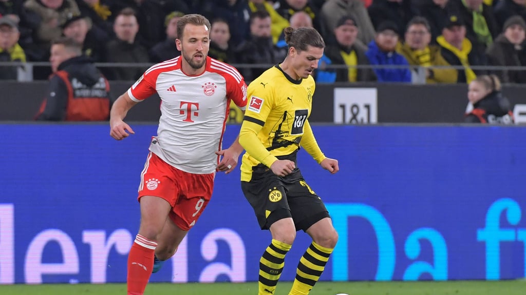 Harry Kane (l.) versucht, Marcel Sabitzer den Ball abzunehmen.