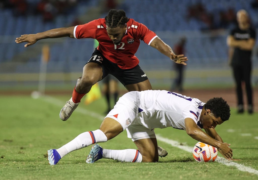 Malik Tillman (unten) unterlag mit den USA Daniel Phillips und Trinidad und Tobago.