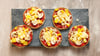 So fix zubereitet wie eine Tiefkühlpizza: Für diese Mini-Pizzen kommen Toastbrötchen zum Einsatz.