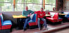 Holger Markmann und Axel Lambrecht sitzen im neuen Diner-Bereich des Rennstalls, von wo aus man auf die Rennstrecke blicken kann.