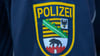 „Polizei“ ist auf einem Ärmelabzeichen der Landespolizei von Sachsen-Anhalt zu lesen.