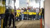 BVB-Fans warten am Flughafen Dortmund am Mannschaftsbus.