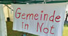 „Gemeinde in Not“, steht auf einem Banner, das Vertreter der Naumburger Katholiken zur Bistumswallfahrt am 1. September zeigten. 