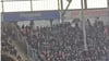 Fans von Hannover 96 beschmieren die Wand des Auswärtsblocks in Magdeburg.