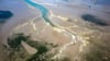 Der Meeresspiegelanstieg und höhere Temperaturen bedrohen das Unesco-Weltnaturerbe Wattenmeer. (Archivbild)