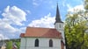 Die Holzkirche in Elend in der Mitte des Ortes.