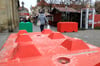 Eine Frau geht an den Beton-Sperren des Magdeburger Weihnachtsmarkts entlang. Nach der Amokfahrt am Freitag vor Weihnachten wurde der Markt am Freitag abgebaut. 