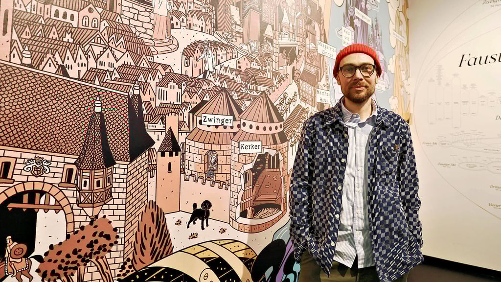 „Solch ein Gewimmel will ich sehen“: Comic-Künstler Simon Schwartz vor seinem „Faust“-Wandbild