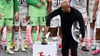 Bayern-Trainer Vincent Kompany stellt bei der Meisterparty eine Kakadu-Figur auf den Sockel.