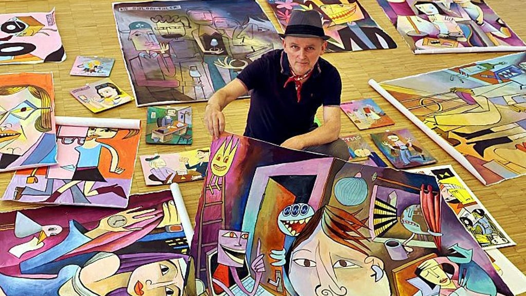 Der Künstler Jim Avignon mit seinen Bildern. Er stellt in Halle in der Zeitkunstgalerie aus.