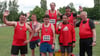 Jubeln über ihre Erfolge in Wittenberg, hinten von links: Jens Stampnik, Robert Stark und Torsten Nitsch, vor ihnen stehen (von links) Andreas Timme, Jan Krannich, Philip Heß und Trainer Michael Schubert.