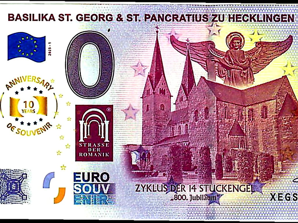 Erstmals gibt es einen 0-Euro-Souvenirschein mit einem Hecklinger Motiv. Passend zum Engel-Jubiläum, auf das der Schein hinweist, zeigt er die romanische Basilika und einen Teil ihrer bedeutendsten Kunstwerke.