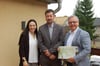 Wohnbau-Prokuristin Lisa-Marie John (v. l.), Bürgermeister Mirko Kother und Geschäftsführer Thomas Glatte freuen sich über die Unternehmenserweiterung am Standort Lützen.