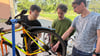 Janneck Stahl, Bodo Gambal und Marcel Eisenmann (v. l. n. r.) haben im Wissenschaftshafen eine Selbsthilfe-Fahrradwerkstatt eröffnet.