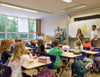 Sie überraschten die Grundschüler der 1c von der Grundschule Ziebigk mit dem Ausblick auf die Ferienangebote in Dessau Roßlau. Hannes Wolf, Agne Tonkunaite-Thiemann und Torsten Schaper  vor der Tafel. 