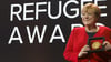 Merkel bei einer Preisverleihung für ihre Flüchtlingspolitik