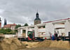 Mit dem Magdeburger Turm in Sichtweite entsteht auf der früheren innerstädtischen Industriebrache ein Mehrfamilienhaus. 