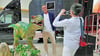 Geschäftsführer Sven Streiff posiert an einem T-Rex in der Lagerhalle in Harbke. 