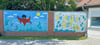 Ein buntes Graffiti an der Wand des sanieren Freibades. Doch das soll erst der Beginn sein. 