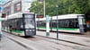 Die ersten beiden neuen Straßenbahnen der MVB treffen einander an der Haltestelle Alter Markt. 