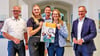 Vertreter der Stadtwerke Wittenberg und aus der Stadtverwaltung, rechts Bürgermeister André Seidig, werben für einen  Tag der offenen Tür. 