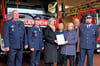 Im Dezember 2024 hatte Ministerin Zieschang (Mi.) den Zuwendungsbescheid für das neue Depot an OB Buchheim und die Wehrleitung übergeben. 