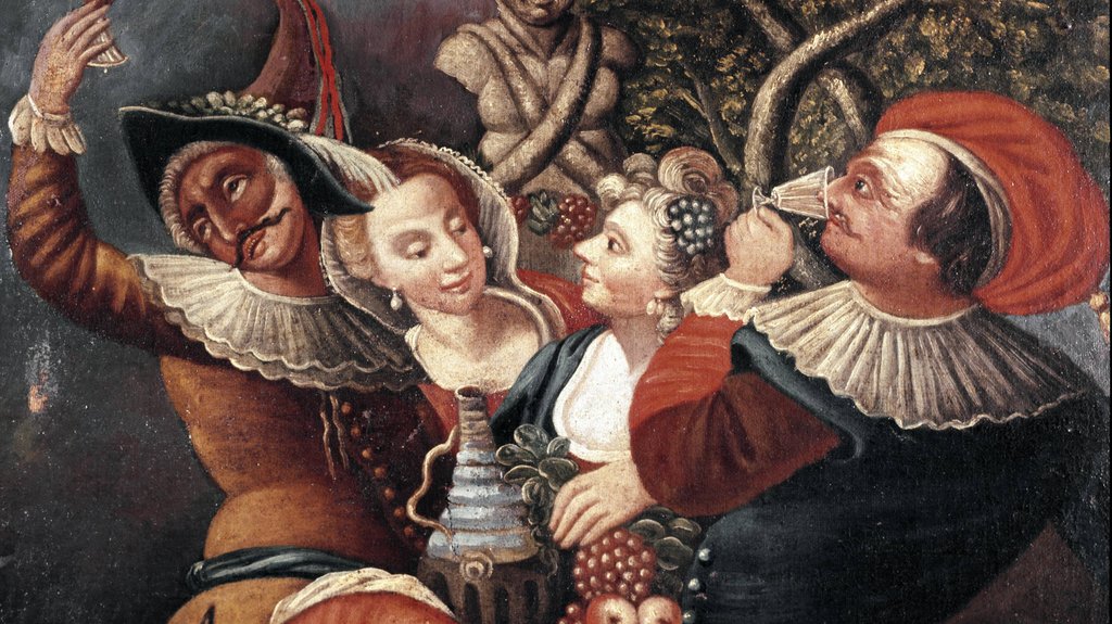 Mitglieder der Commedia dell'arte trinken Wein vor einer Büste des Bacchus.<strong></strong>