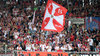 Die Fahne der Holy Bulls weht über dem Fanblock von RB Leipzig.